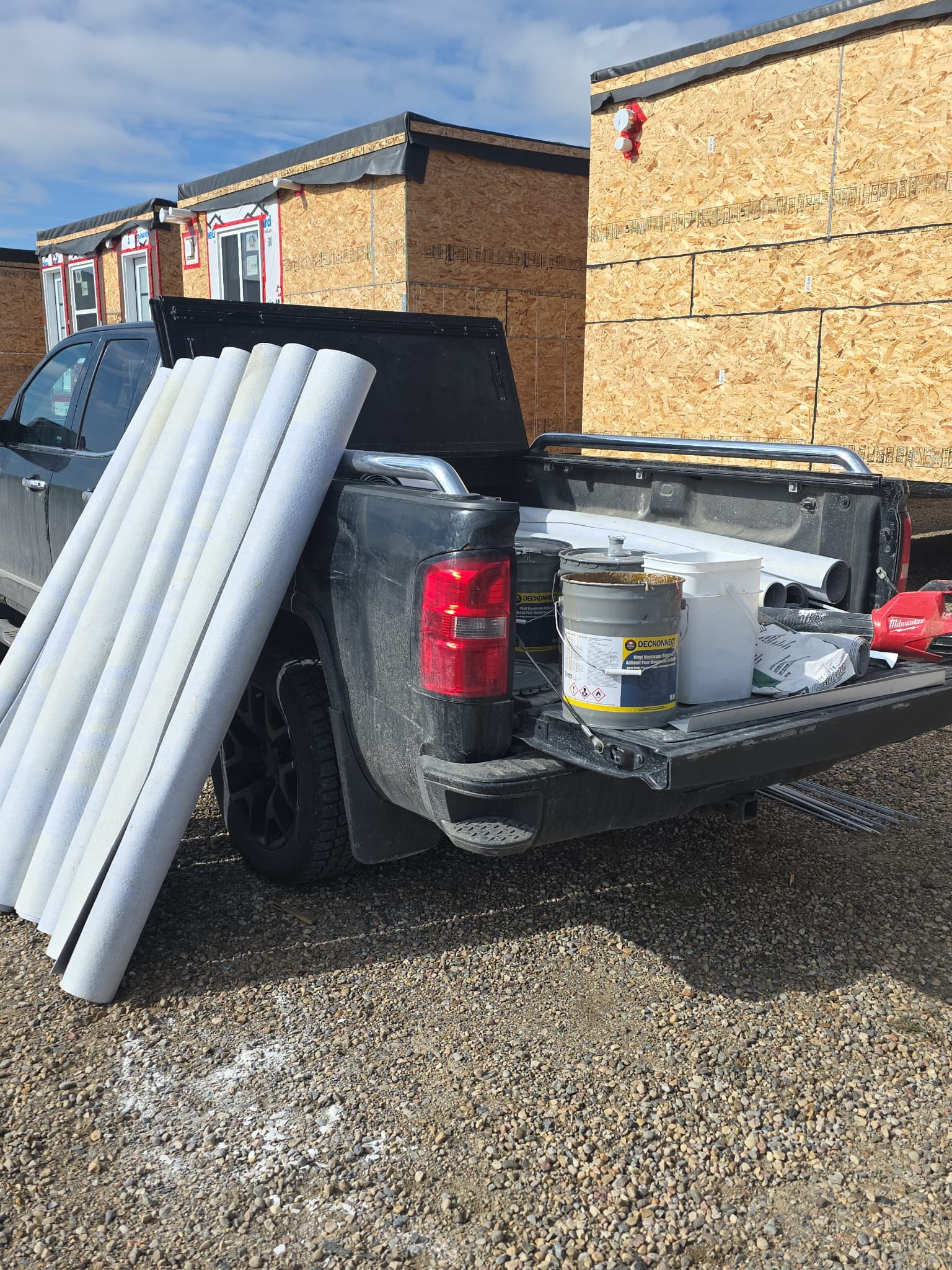 Vinyl decking materials and supplies staged at an OBYS-OVIE job site